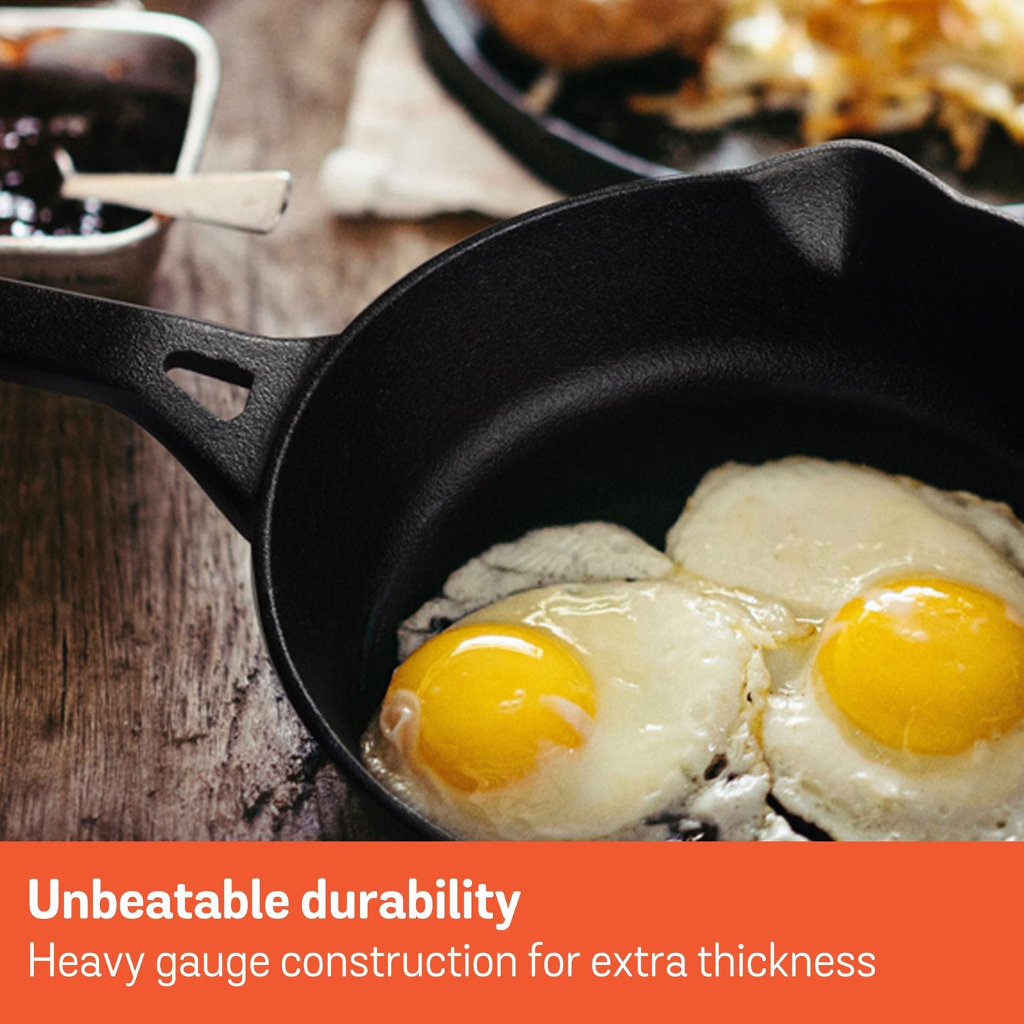 Meyer pre-seasoned cast iron skillet frying two eggs with text "Unbeatable durability"