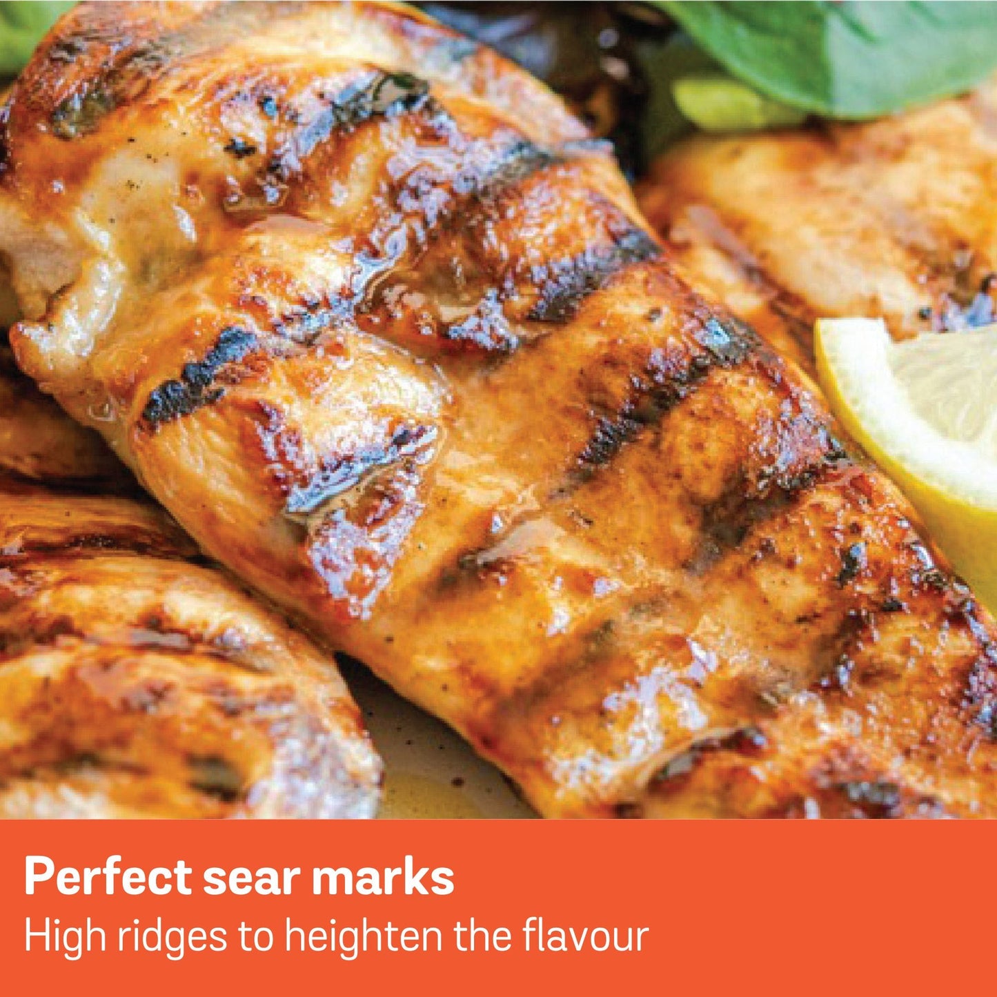 Grilled chicken with perfect sear marks and a lemon wedge.