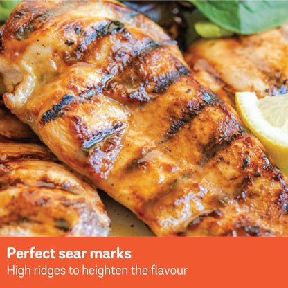 Grilled chicken with perfect sear marks and a lemon wedge.